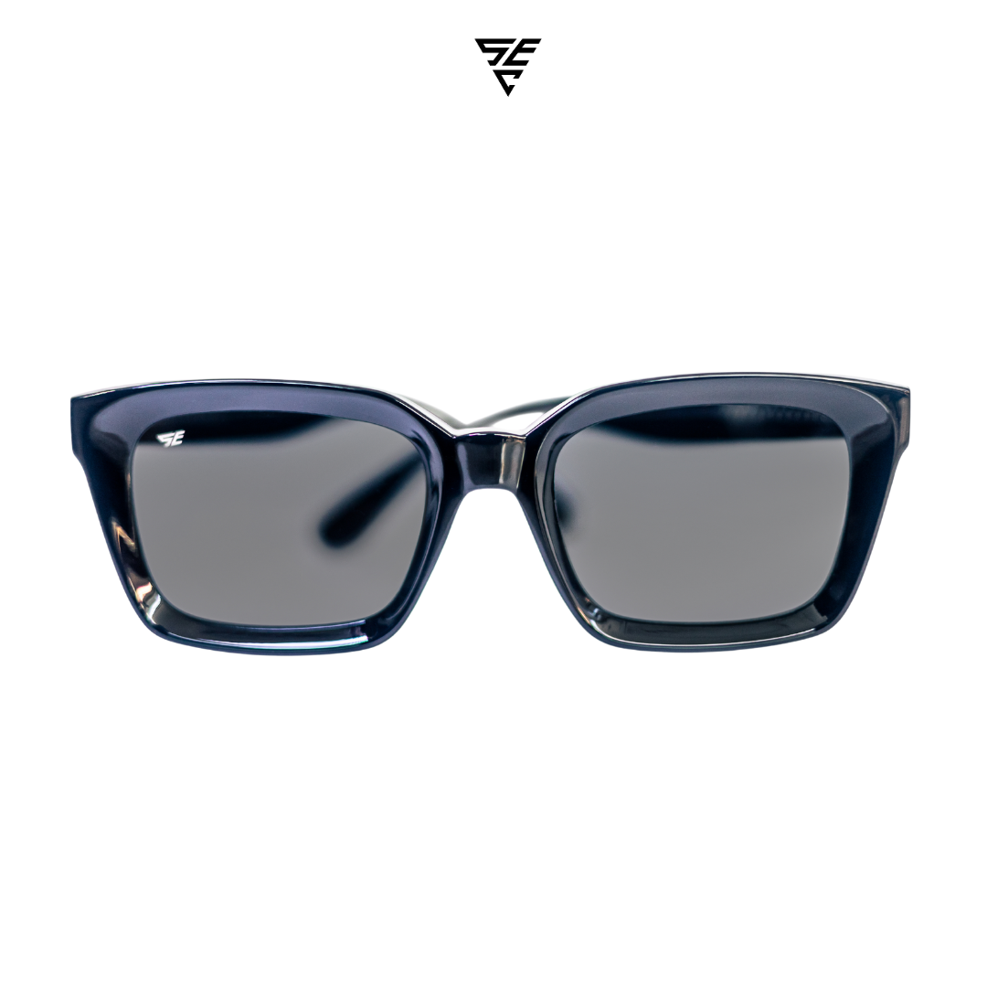 Embodying a classic unisex style, these all-black rectangular block sunglasses offer a timeless elegance that effortlessly exudes sophistication. The silver metal accent discreetly placed inside the arms adds a touch of refinement, unveiling a hidden world of opulence. A perfect blend of exclusivity and grace, these sunglasses offer the perfect accessory to give off an expensive and elegant look.