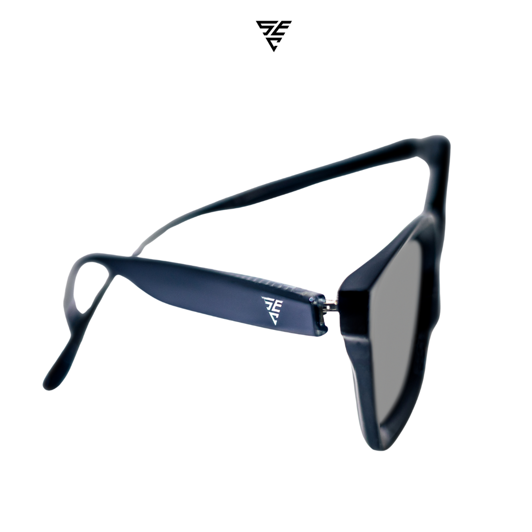 Embodying a classic unisex style, these all-black rectangular block sunglasses offer a timeless elegance that effortlessly exudes sophistication. The silver metal accent discreetly placed inside the arms adds a touch of refinement, unveiling a hidden world of opulence. A perfect blend of exclusivity and grace, these sunglasses offer the perfect accessory to give off an expensive and elegant look.