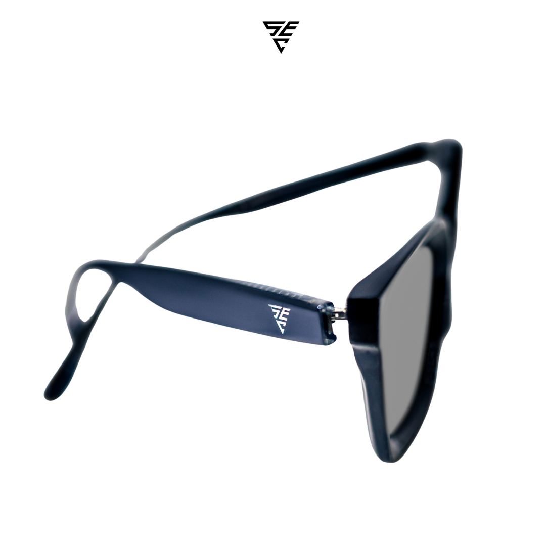 Embodying a classic unisex style, these all-black rectangular block sunglasses offer a timeless elegance that effortlessly exudes sophistication. The silver metal accent discreetly placed inside the arms adds a touch of refinement, unveiling a hidden world of opulence. A perfect blend of exclusivity and grace, these sunglasses offer the perfect accessory to give off an expensive and elegant look. 